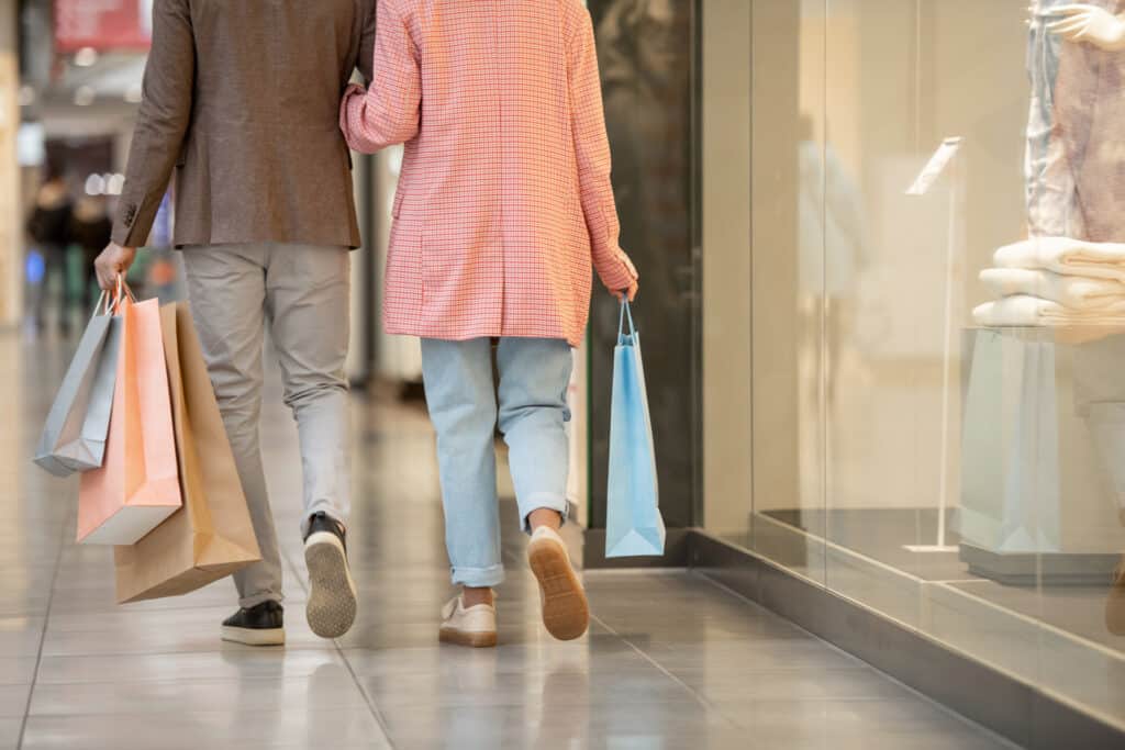 Couple shopping together in an indoor shopping center