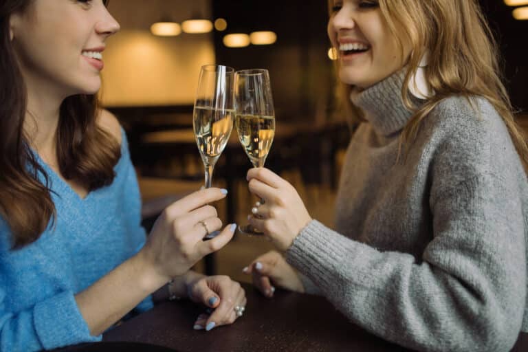 Smiling,Girls,Holding,Glasses,Of,Prosecco,And,Making,Cheers,In